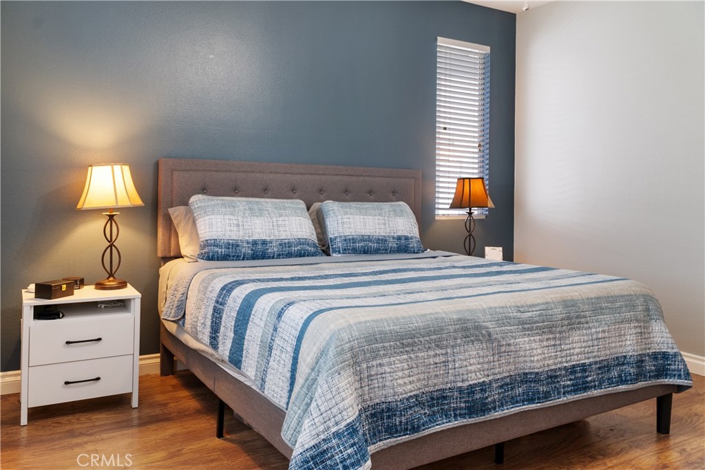 20808 Millbrook Street Riverside, CA 92508 - Photo 28 of 51 a bedroom with a bed and a night stand