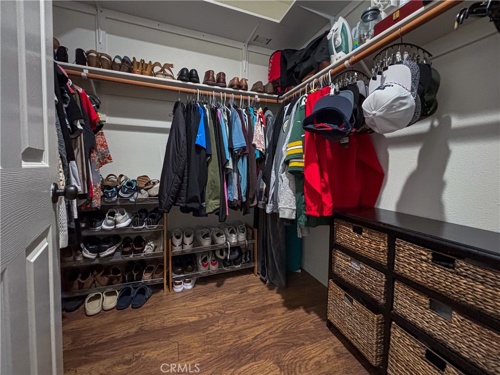 20808 Millbrook Street Riverside, CA 92508 - Photo 34 of 51 a view of walk in closet with clothes and shoes