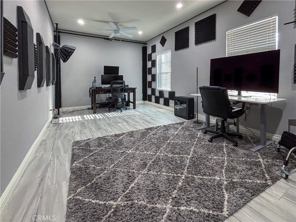 20808 Millbrook Street Riverside, CA 92508 - Photo 38 of 51 a living room with furniture a flat screen tv and a fireplace