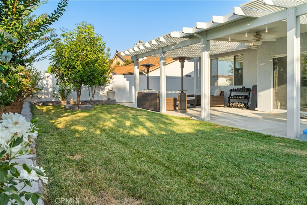 20808 Millbrook Street Riverside, CA 92508 - Photo 49 of 51 a swimming pool with outdoor seating and yard