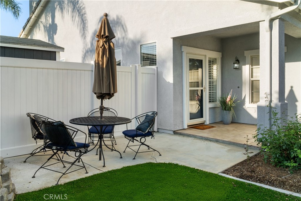 20808 Millbrook Street Riverside, CA 92508 - Photo 7 of 51 a backyard of a house with table and chairs