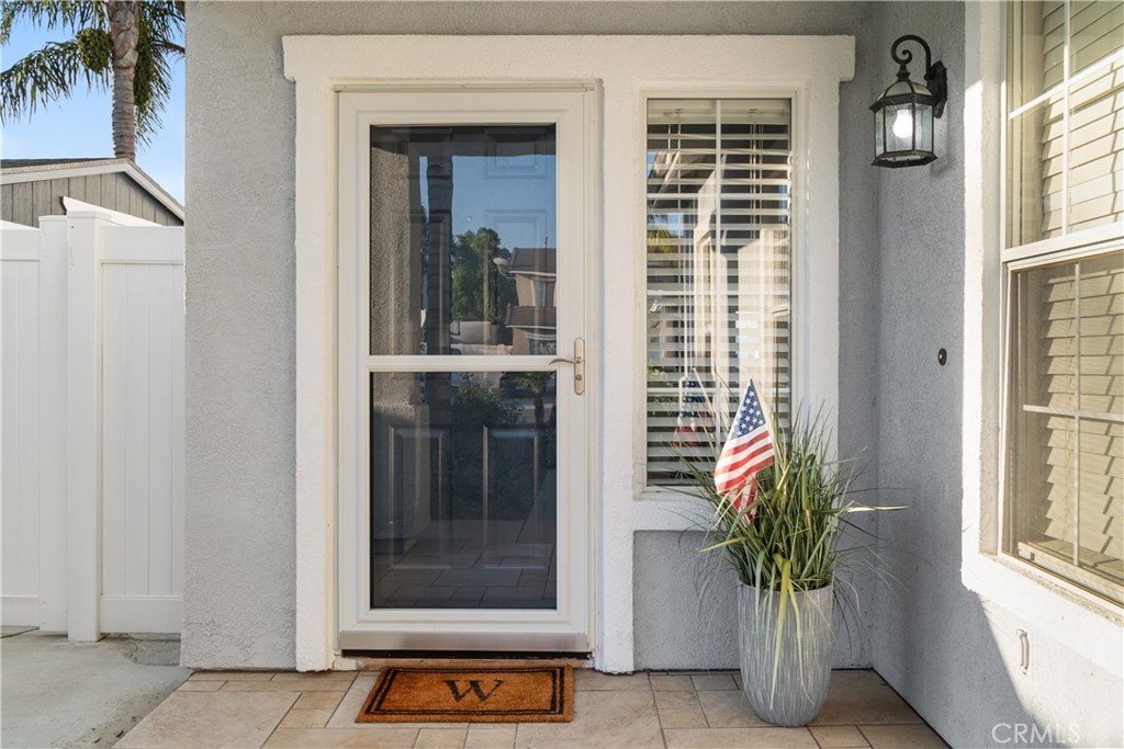 20808 Millbrook Street Riverside, CA 92508 - Photo 9 of 51 a potted plant sitting in front of a door