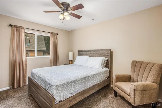 a bedroom with a bed and couch