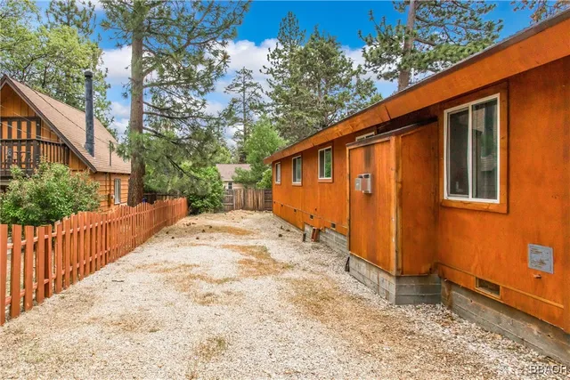 a view of a backyard of the house
