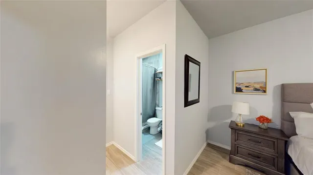 a living room with furniture and baby crib