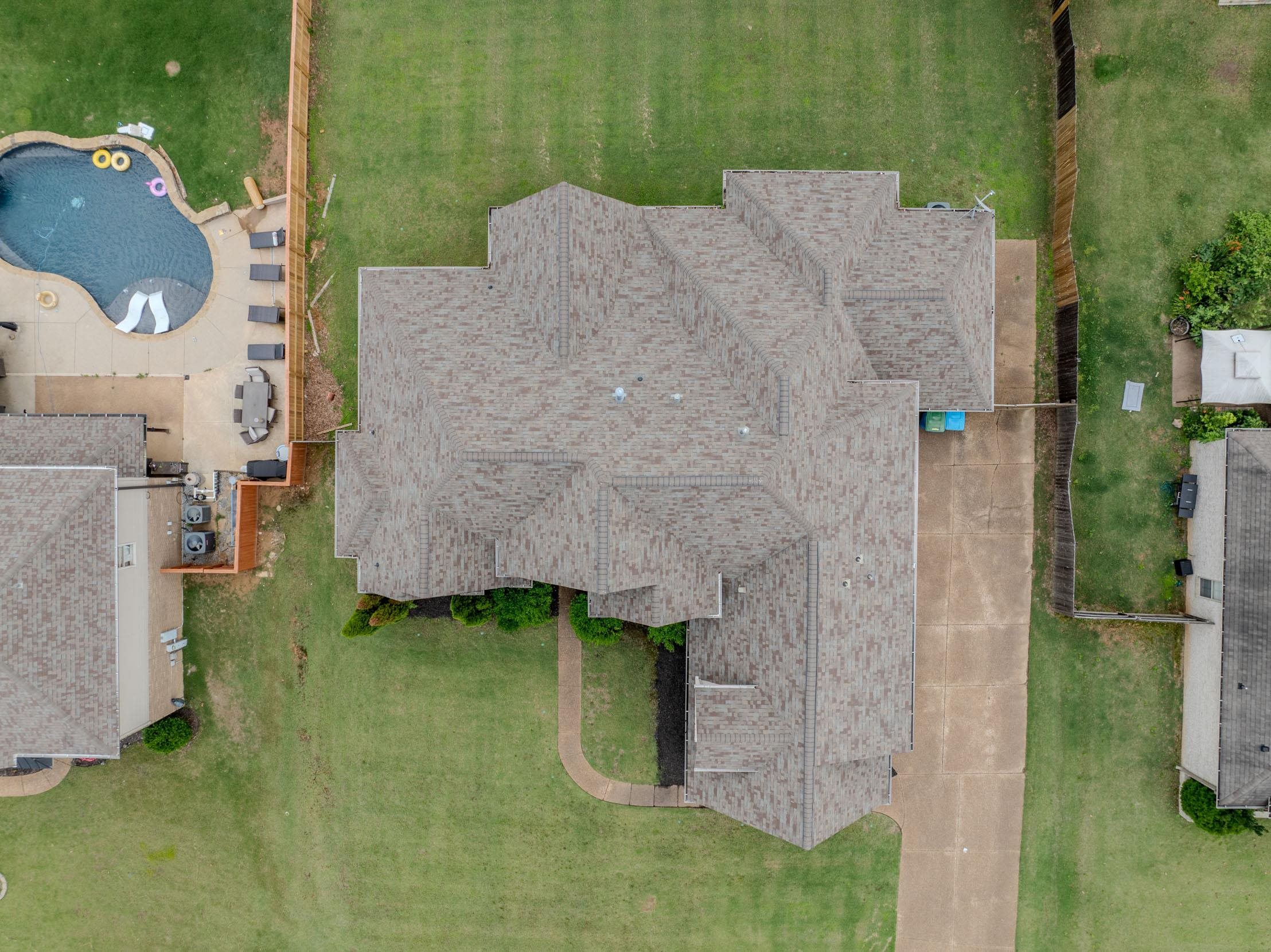 5380 Scarlet Ridge Drive Arlington, TN 38002 - Photo 27 of 35 Main residence featuring a multi-gabled roofline, an expansive paved driveway, and a manicured lawn