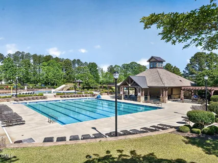 a view of a house with swimming pool and view of a swimming pool