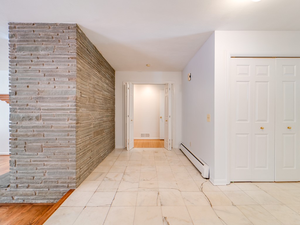 4 Tuxford Road Pittsford, NY 14534 - Photo 21 of 38 The ledgerock wall adds character upon arrival in