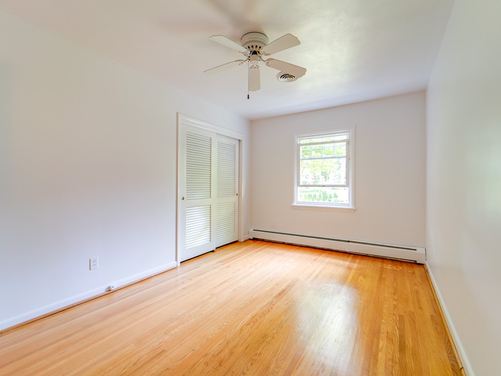 4 Tuxford Road Pittsford, NY 14534 - Photo 27 of 38 One of the three rooms with fan, window and closet