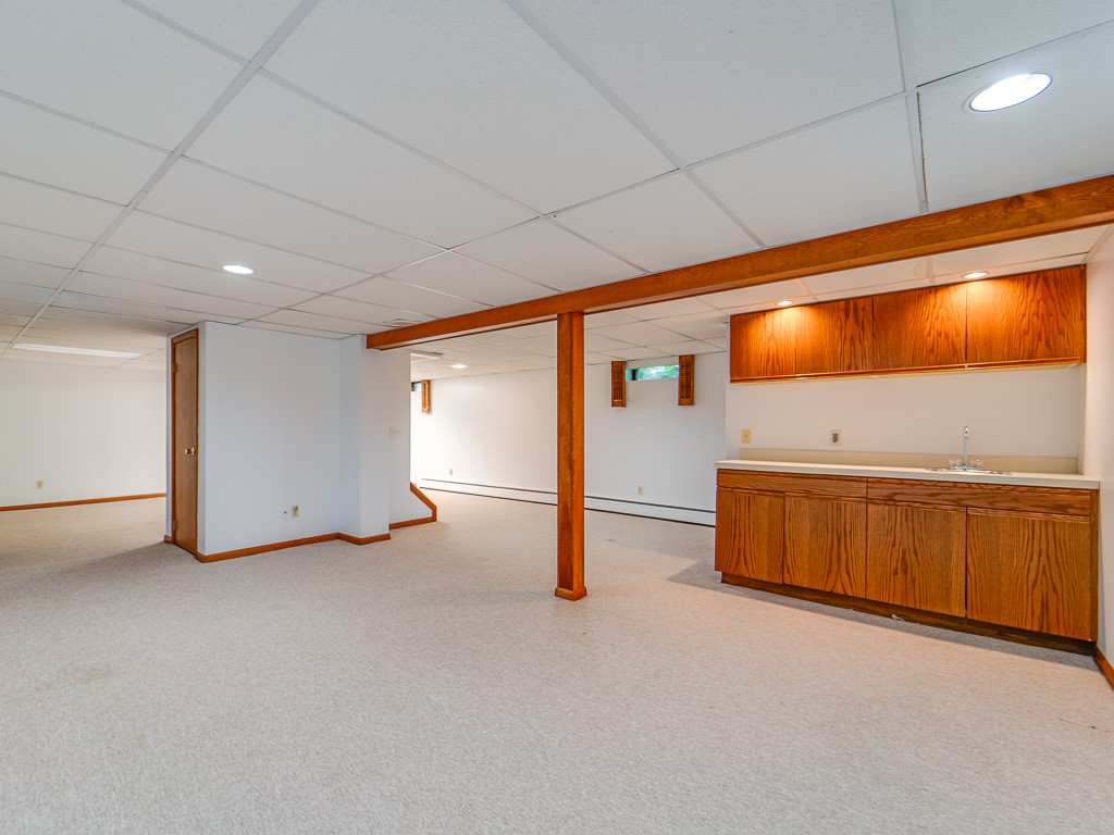 4 Tuxford Road Pittsford, NY 14534 - Photo 31 of 38 A wet bar perfect for teen entertaining in the low