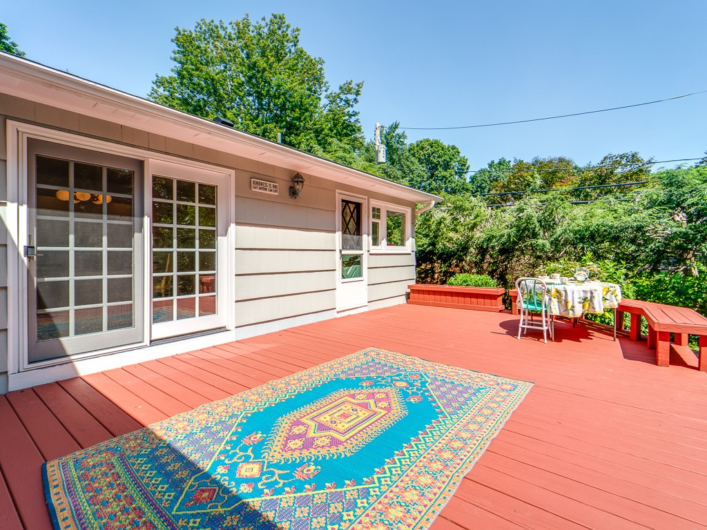 4 Tuxford Road Pittsford, NY 14534 - Photo 33 of 38 The deck overlooks a lush lot and is an idyllic pl