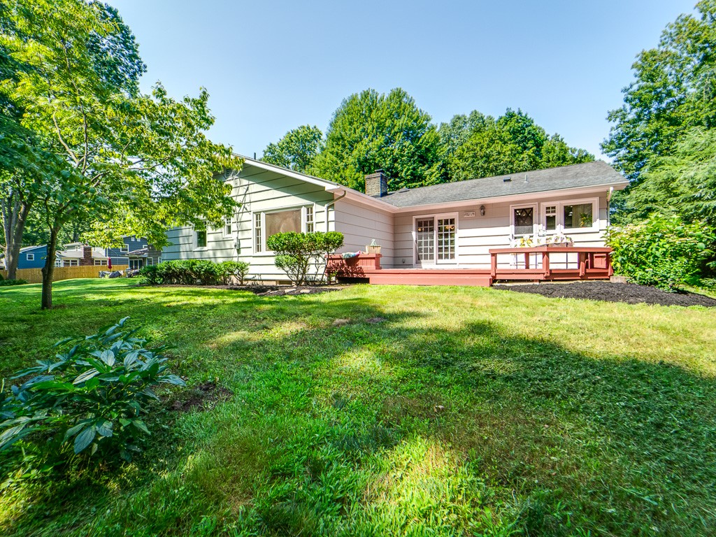 4 Tuxford Road Pittsford, NY 14534 - Photo 36 of 38 The backyard is adorned with hibiscus plants and l