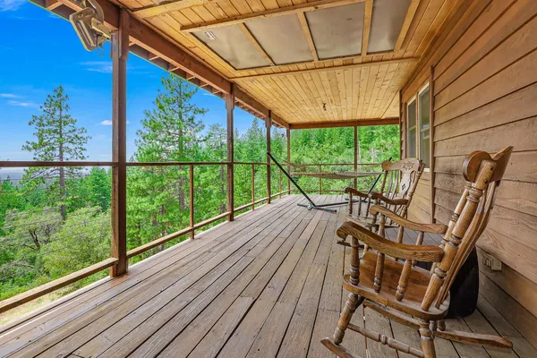 a view of a balcony with furniture
