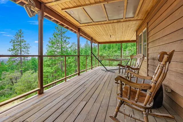 a view of a balcony with furniture