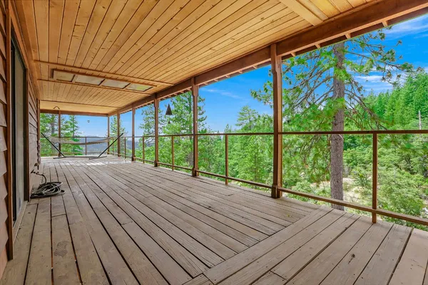 a view of balcony with wooden floor