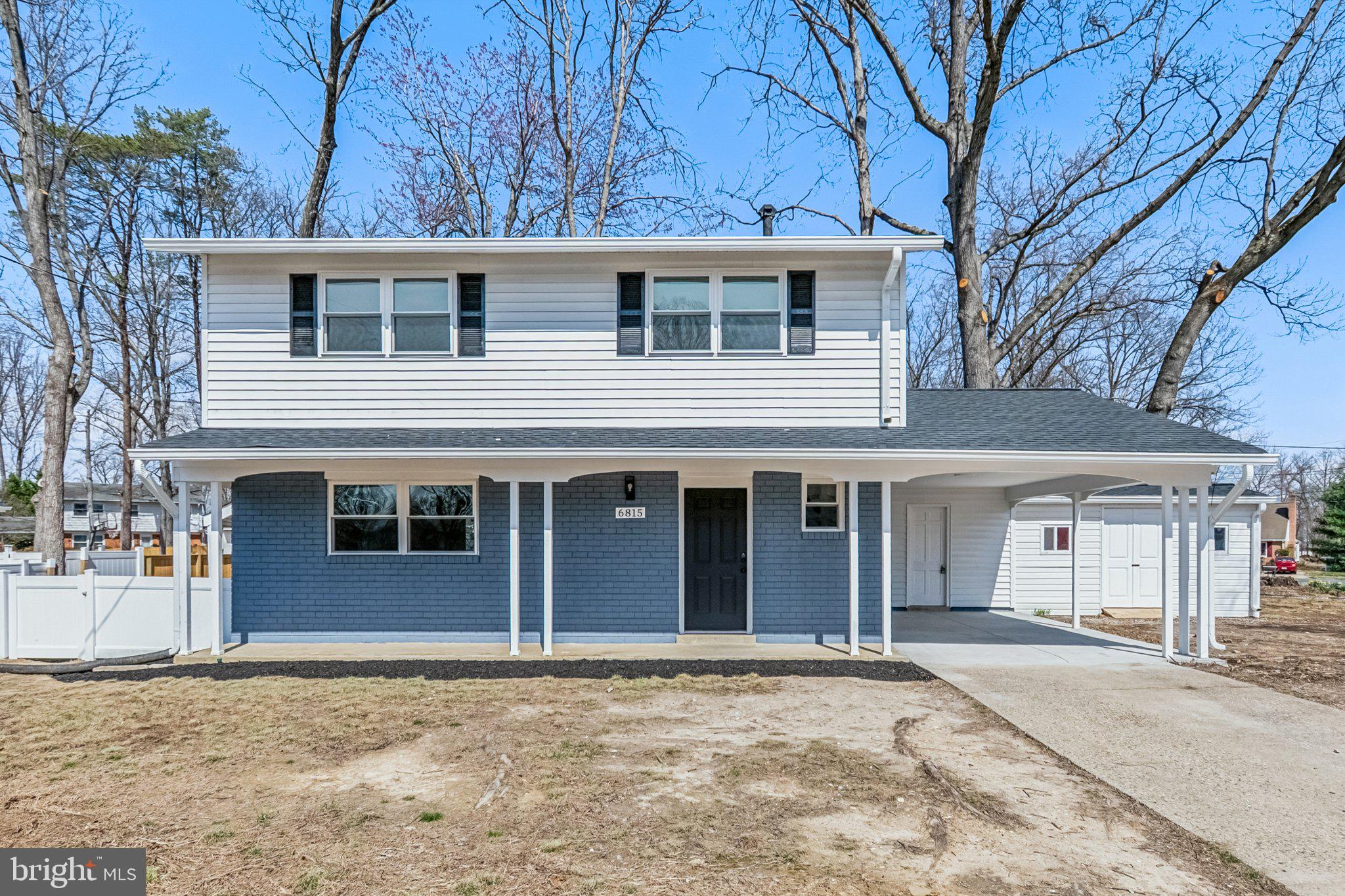 6815 Rolling Road Springfield, VA 22152 - Photo 1 of 40 a house with a outdoor space