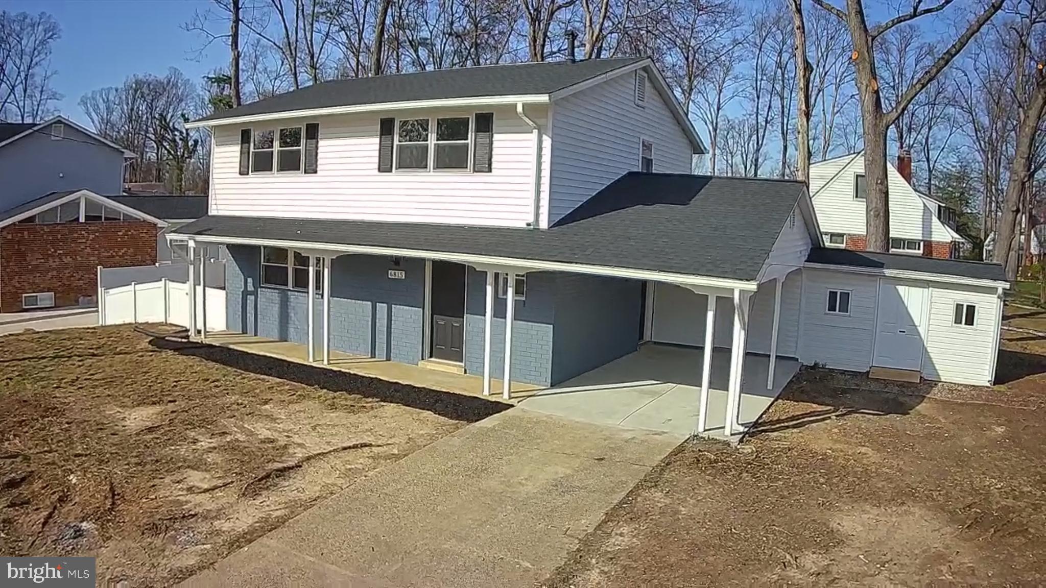 6815 Rolling Road Springfield, VA 22152 - Photo 12 of 40 a house with trees in front of it