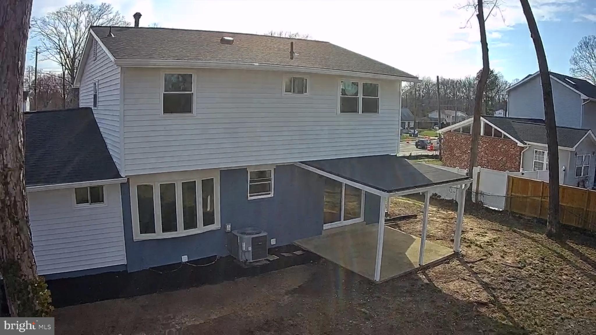 6815 Rolling Road Springfield, VA 22152 - Photo 14 of 40 a view of a house with a patio