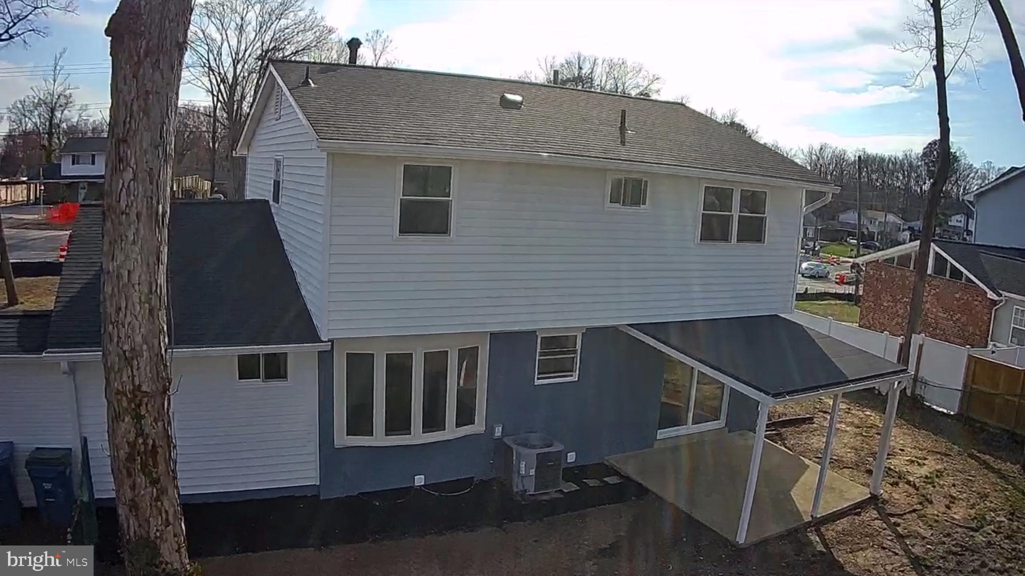 6815 Rolling Road Springfield, VA 22152 - Photo 15 of 40 a front view of a house with a yard