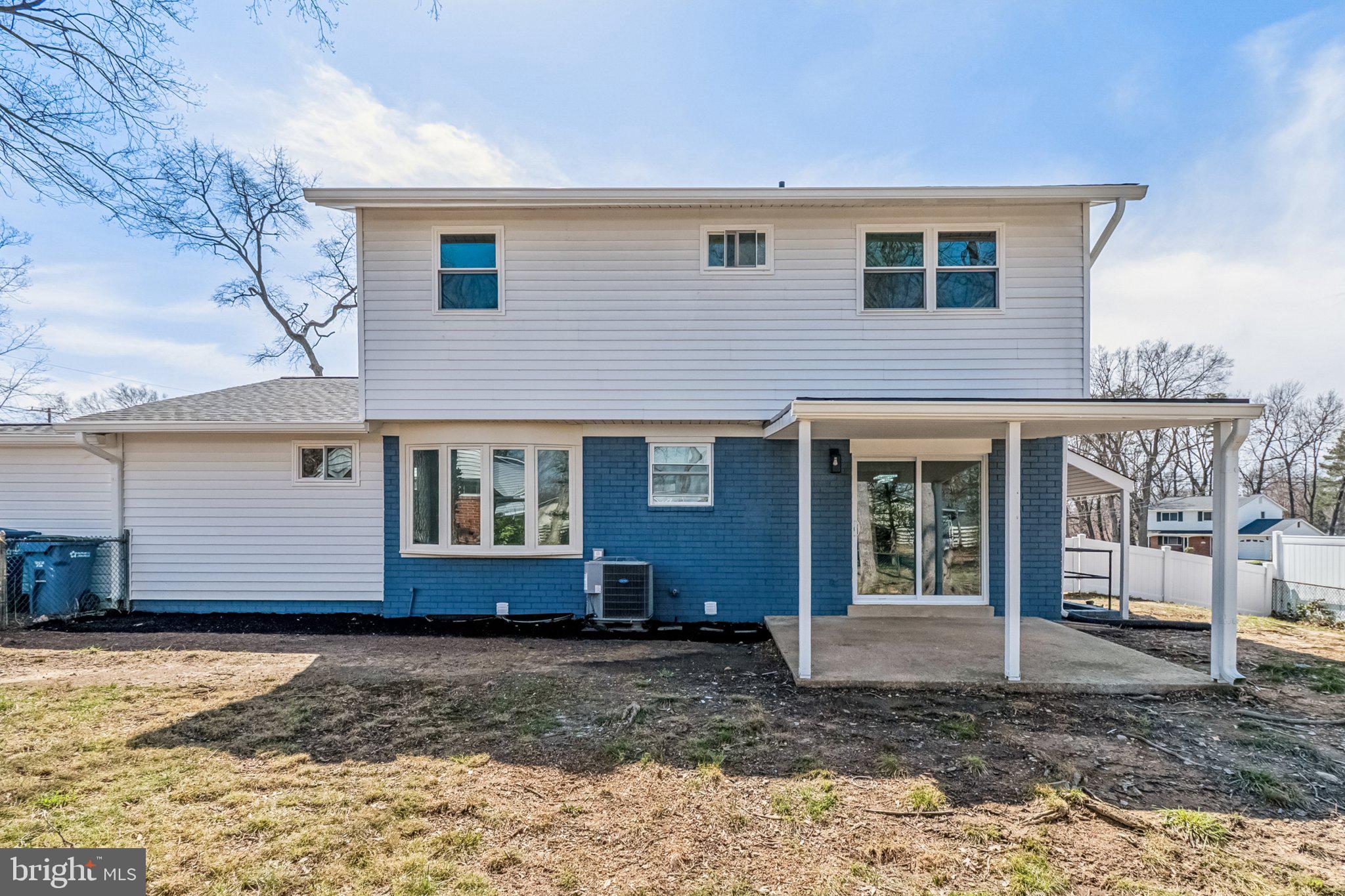 6815 Rolling Road Springfield, VA 22152 - Photo 3 of 40 a front view of a house with garden