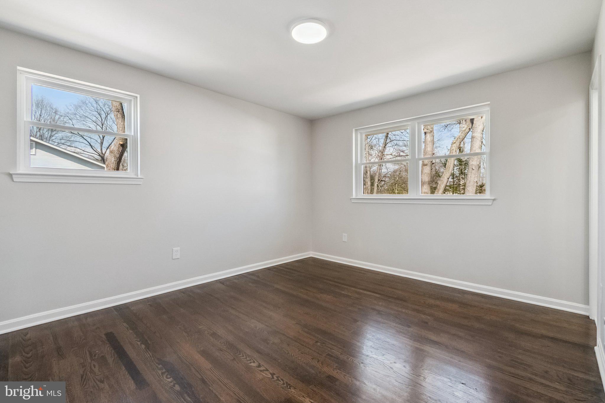 6815 Rolling Road Springfield, VA 22152 - Photo 35 of 40 a view of room with wooden floor and window