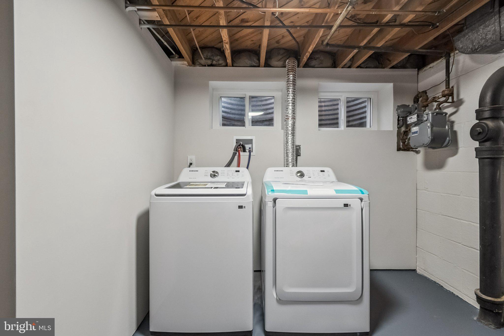 6815 Rolling Road Springfield, VA 22152 - Photo 40 of 40 a utility room with dryer and washer