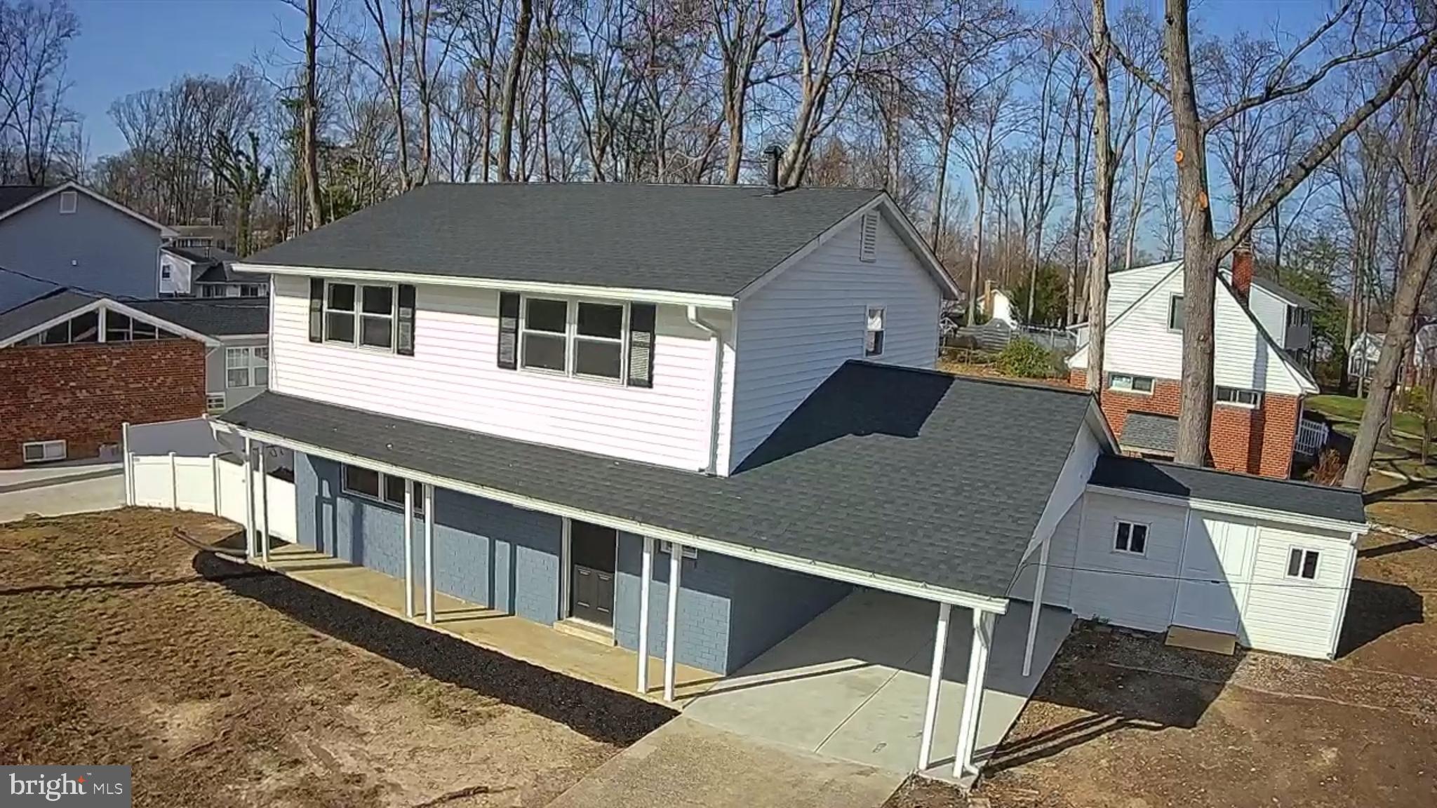 6815 Rolling Road Springfield, VA 22152 - Photo 6 of 40 a view of a house with wooden fence