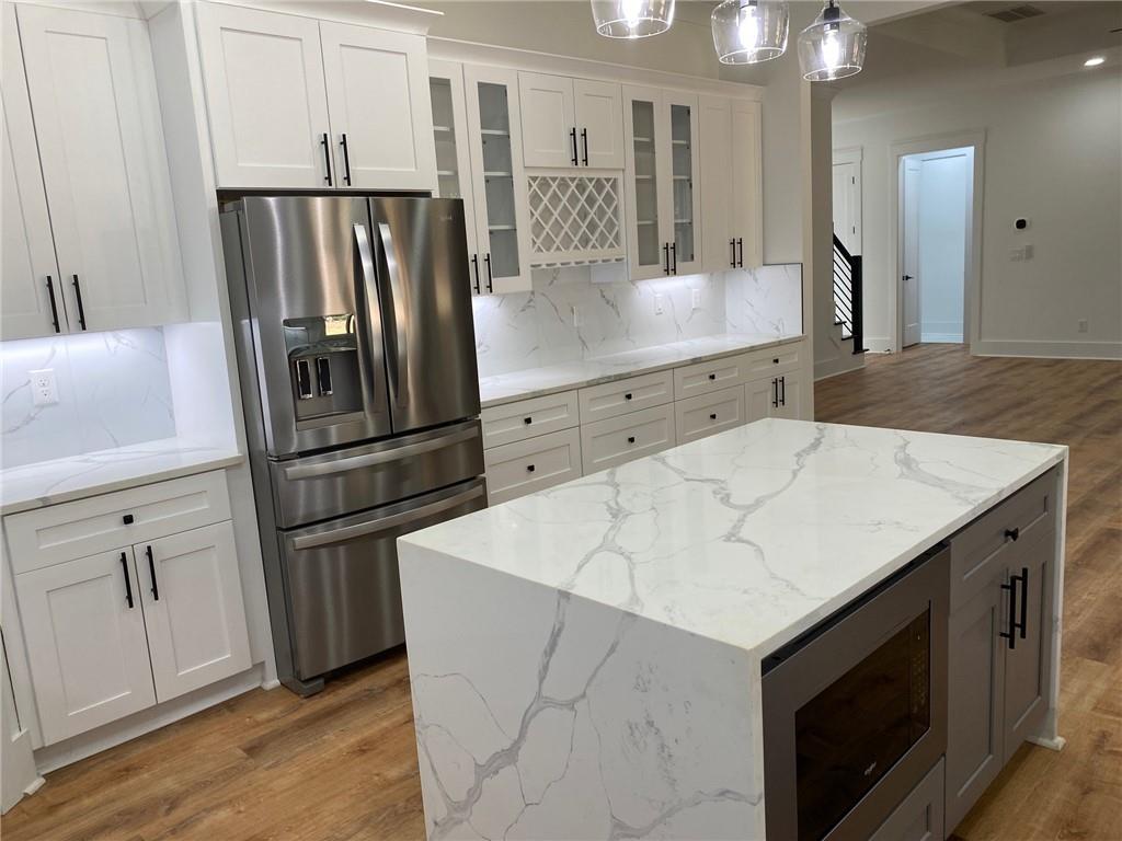 1271 Ga-138 Monroe, GA 30655 - Photo 12 of 40 a kitchen with a sink stainless steel appliances and cabinets