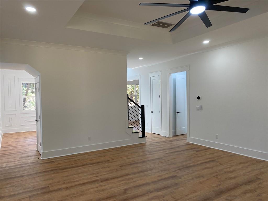 1271 Ga-138 Monroe, GA 30655 - Photo 21 of 40 an empty room with wooden floor fan and windows