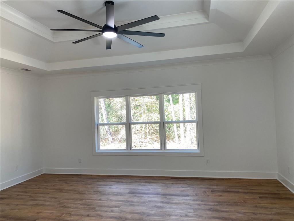 1271 Ga-138 Monroe, GA 30655 - Photo 25 of 40 a view of an empty room with wooden floor and a window