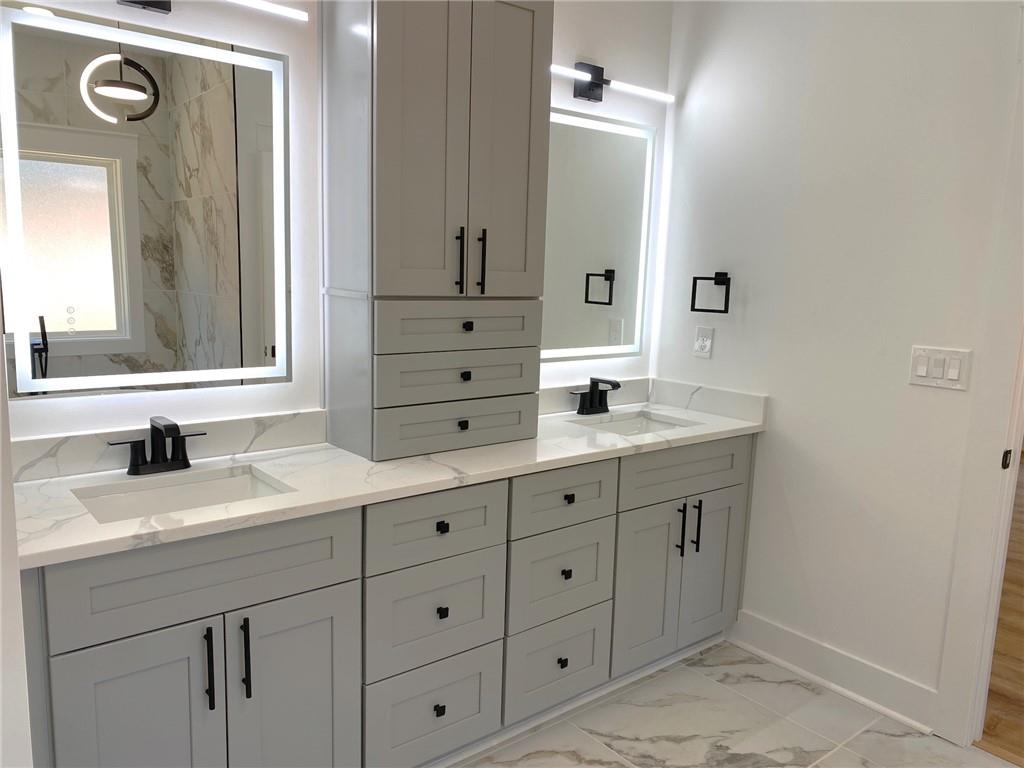 1271 Ga-138 Monroe, GA 30655 - Photo 27 of 40 a bathroom with a double vanity sink mirror and double