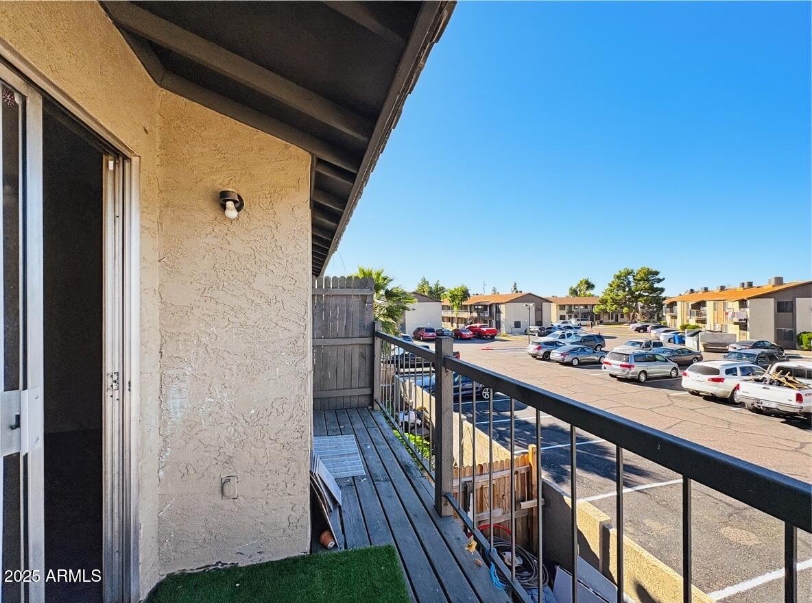 10820 North 16th Avenue, Unit 4 Phoenix, AZ 85029 - Photo 11 of 11 a view of a balcony with car parked