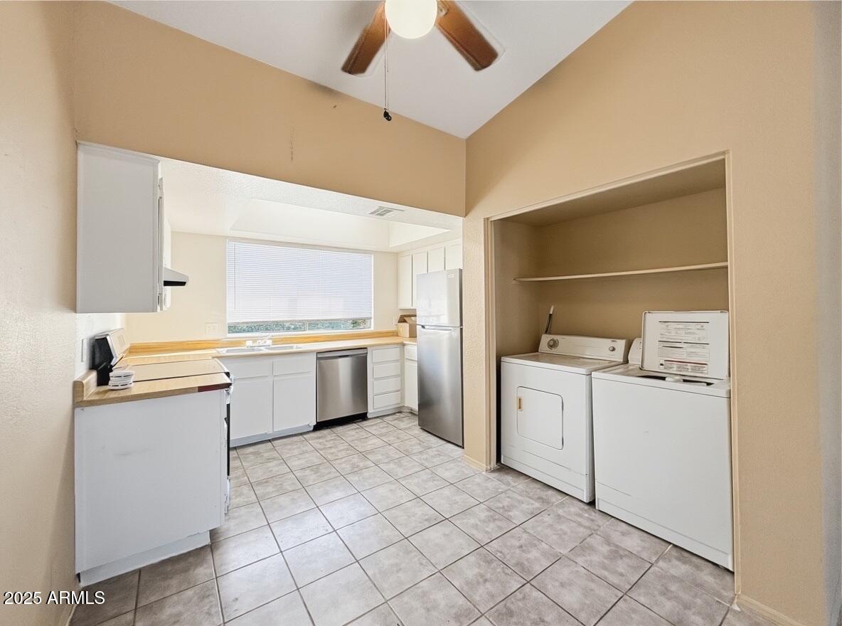 10820 North 16th Avenue, Unit 4 Phoenix, AZ 85029 - Photo 3 of 11 a kitchen with a stove top oven cabinets a sink and a counter top space
