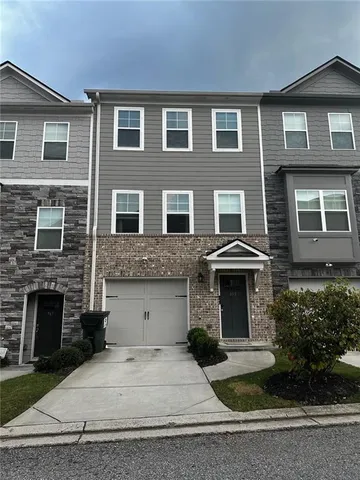 a front view of a house with yard