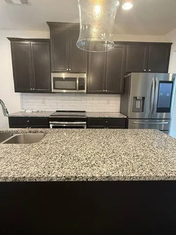 a bathroom with a sink a vanity and a mirror