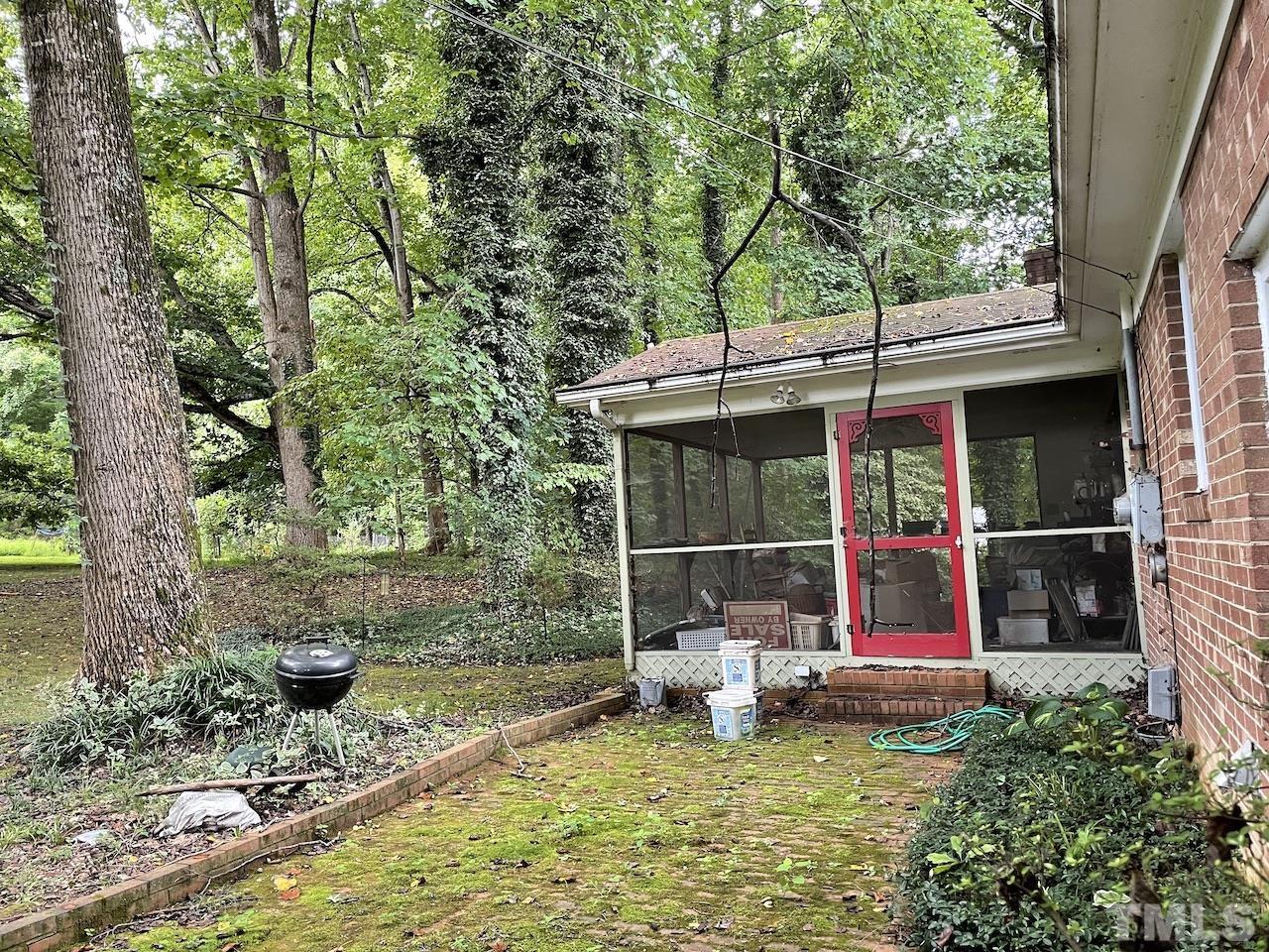 401 Andover Road Durham, NC 27712 - Photo 2 of 15 a backyard of a house with table and chairs