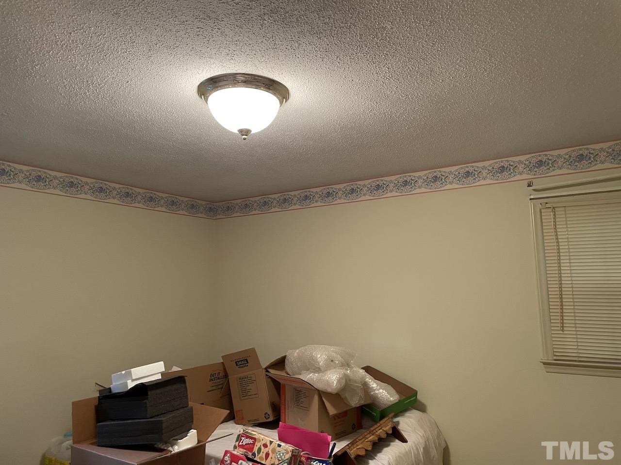 401 Andover Road Durham, NC 27712 - Photo 10 of 15 a bedroom with a bed and a window