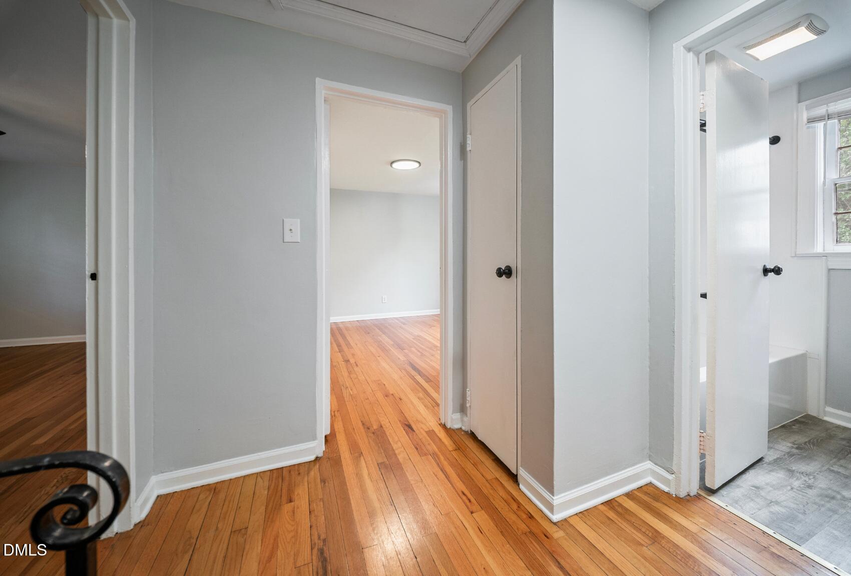967 St Marys Street Raleigh, NC 27605 - Photo 20 of 34 a view of a room with wooden floor and bathroom