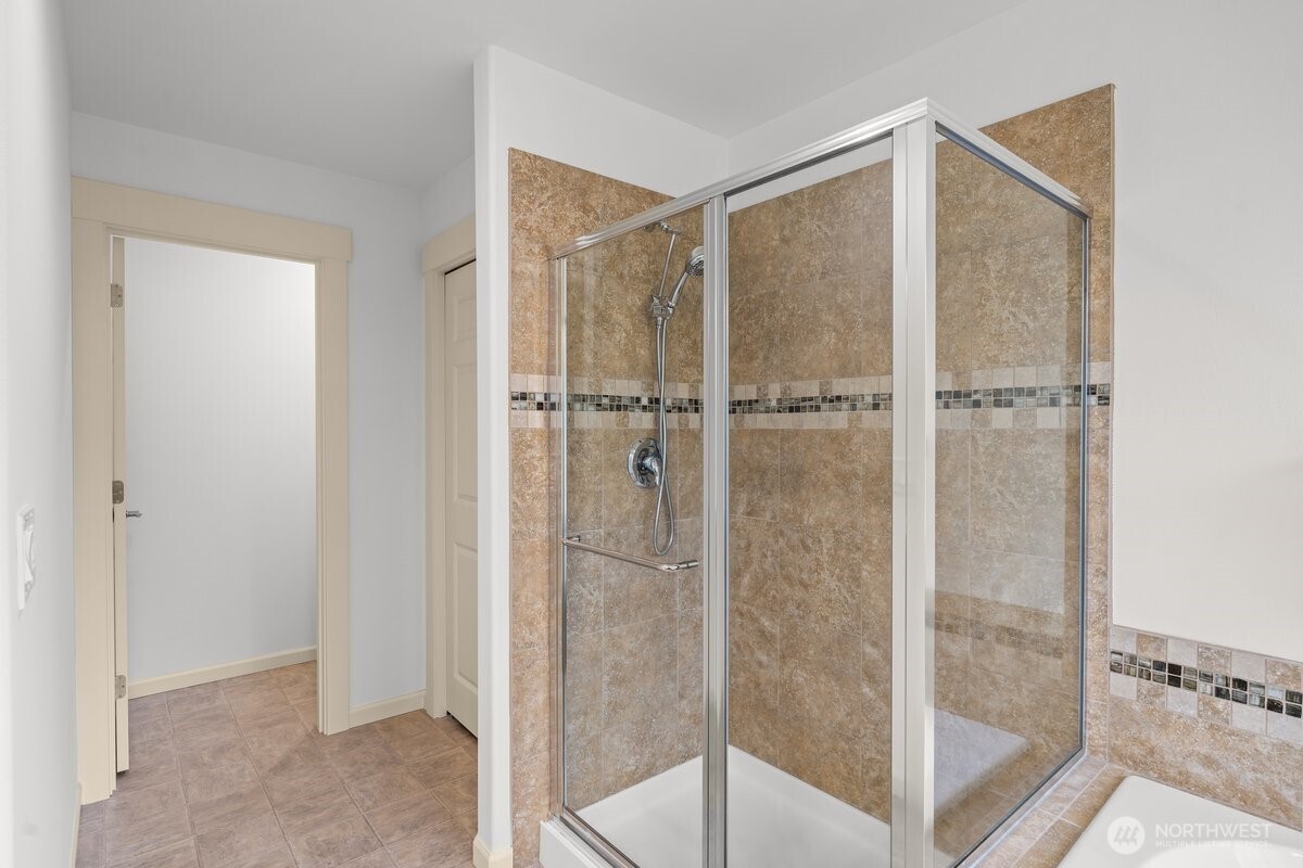 603 194th Place Southeast Bothell, WA 98012 - Photo 14 of 30 a bathroom with a glass shower door
