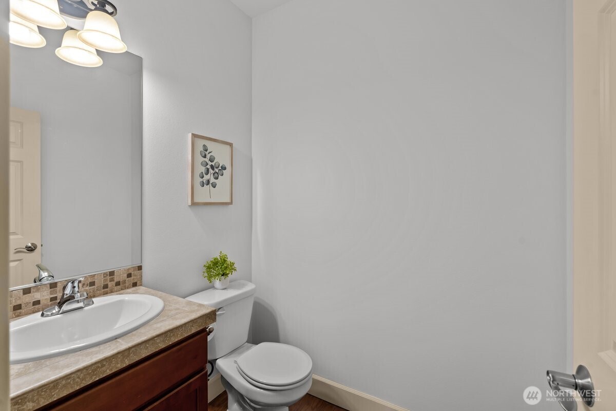 603 194th Place Southeast Bothell, WA 98012 - Photo 15 of 30 a bathroom with a toilet a sink and mirror