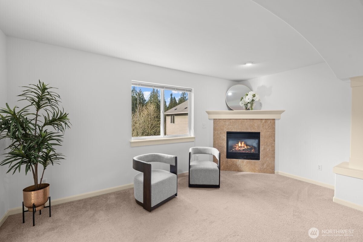 603 194th Place Southeast Bothell, WA 98012 - Photo 18 of 30 a living room with furniture and a fireplace