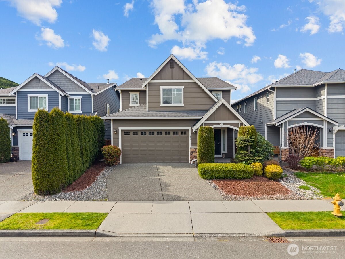 603 194th Place Southeast Bothell, WA 98012 - Photo 2 of 30 a front view of a house with garden