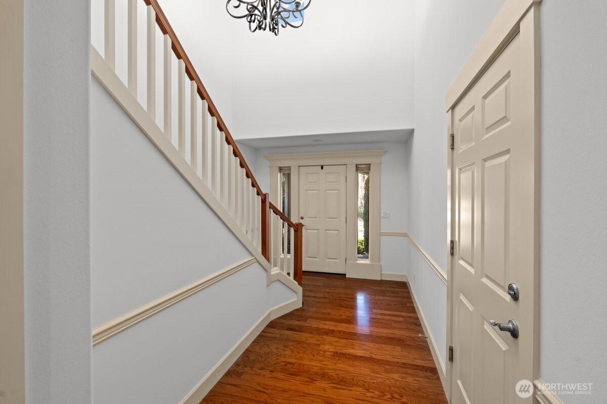 603 194th Place Southeast Bothell, WA 98012 - Photo 4 of 30 a view of a hallway with wooden floor and staircase