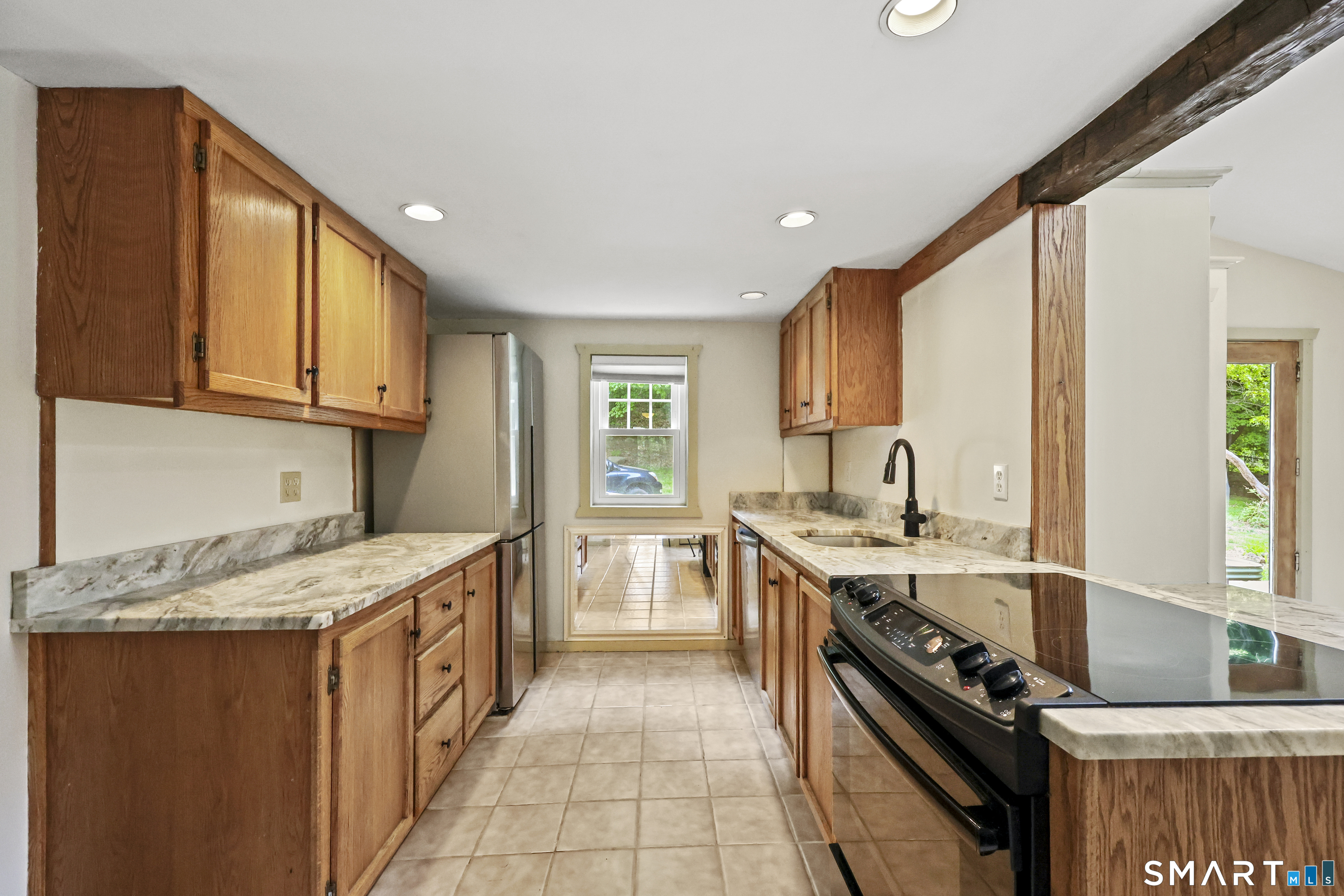 917 Hopewell Road Glastonbury, CT 06033 - Photo 5 of 39 a kitchen with a sink stove top oven and cabinets