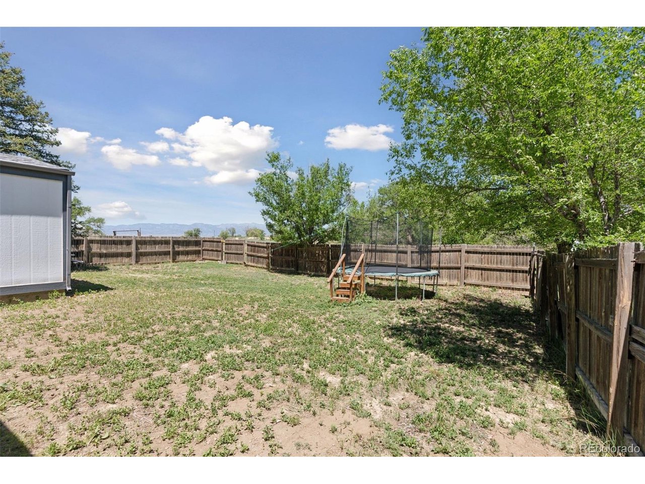 16880 Old Pueblo Road Fountain, CO 80817 - Photo 23 of 49 Fenced yard area associated with the second single-family residence, offering private outdoor space w/views of the mountains in the distance.
