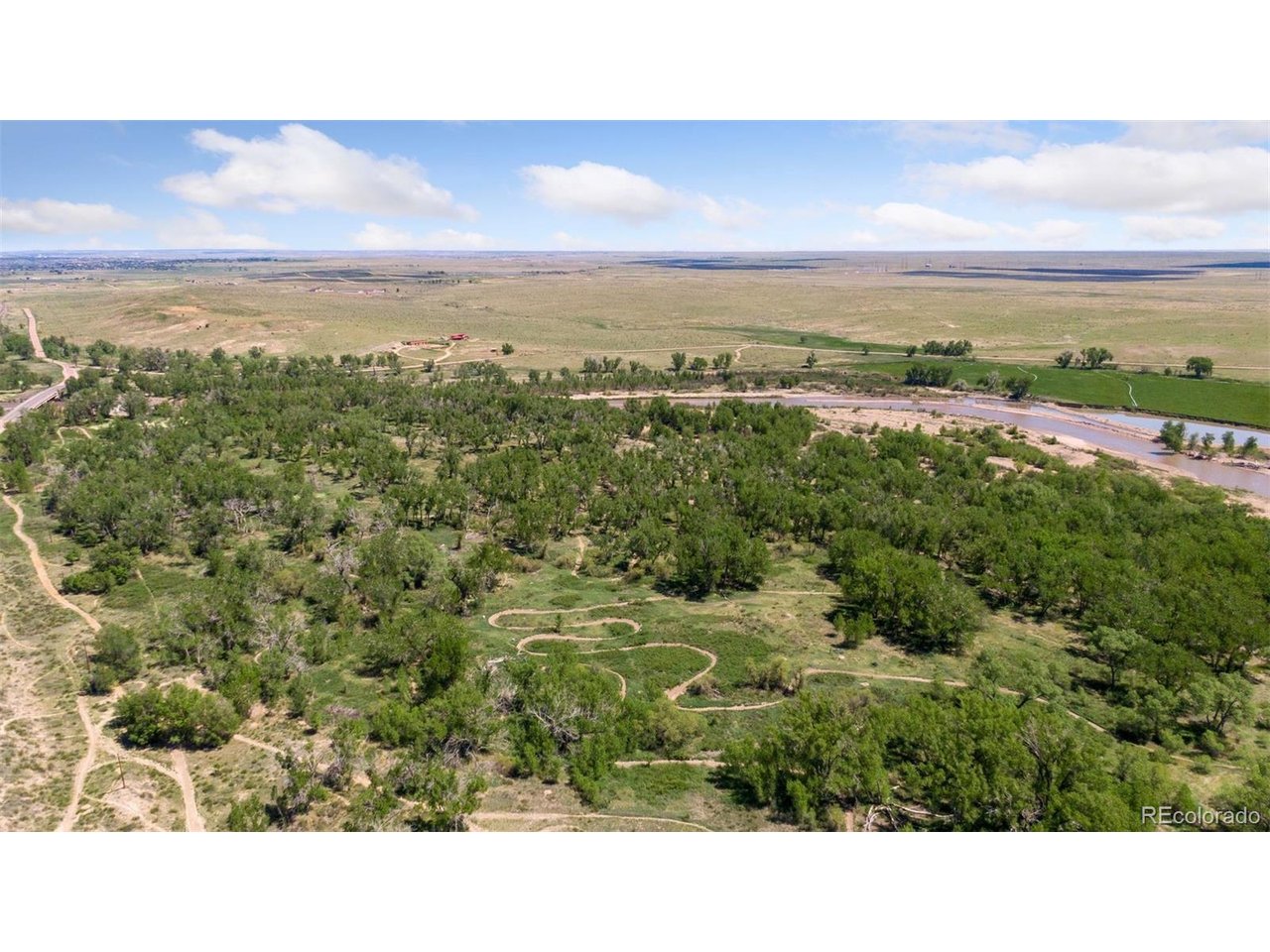 16880 Old Pueblo Road Fountain, CO 80817 - Photo 5 of 49 View capturing the scale of the property and a portion of its extensive private motocross trail network, thoughtfully integrated into the natural landscape