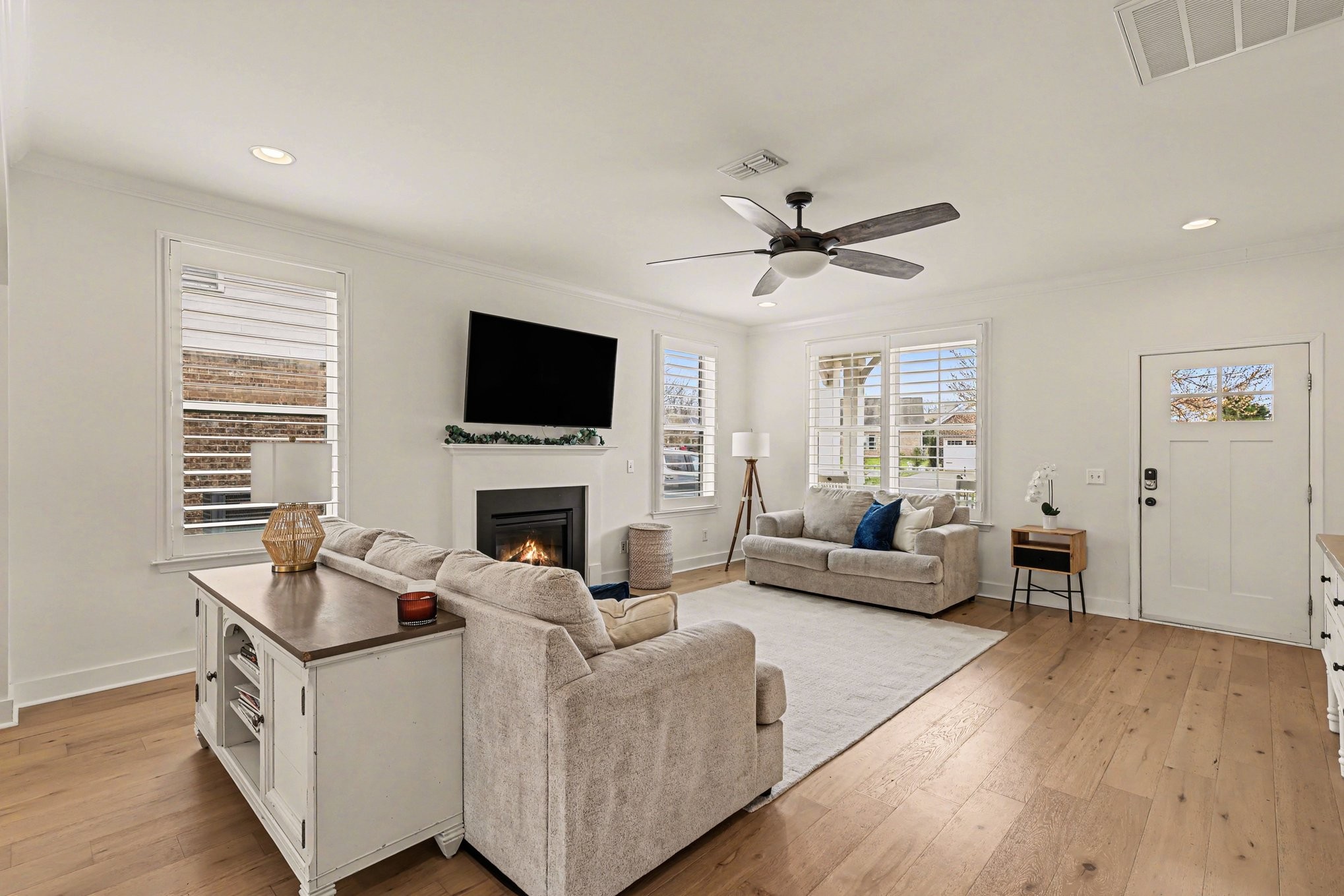 744 Bench Lane Mount Juliet, TN 37122 - Photo 5 of 27 a living room with furniture a fireplace and a flat screen tv