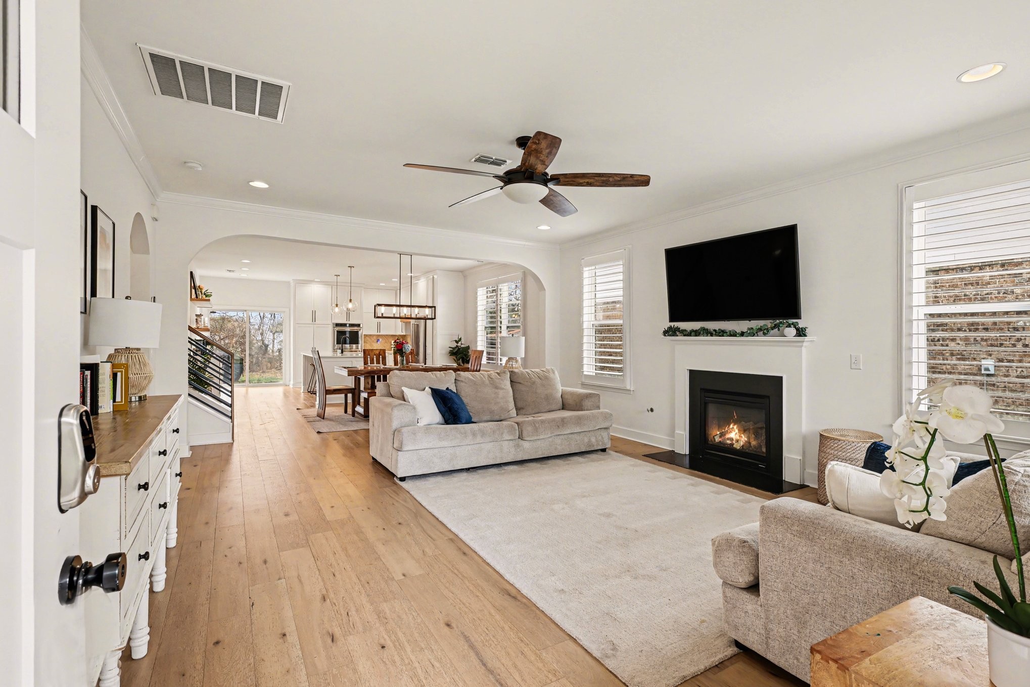 744 Bench Lane Mount Juliet, TN 37122 - Photo 6 of 27 a living room with furniture a fireplace and a flat screen tv
