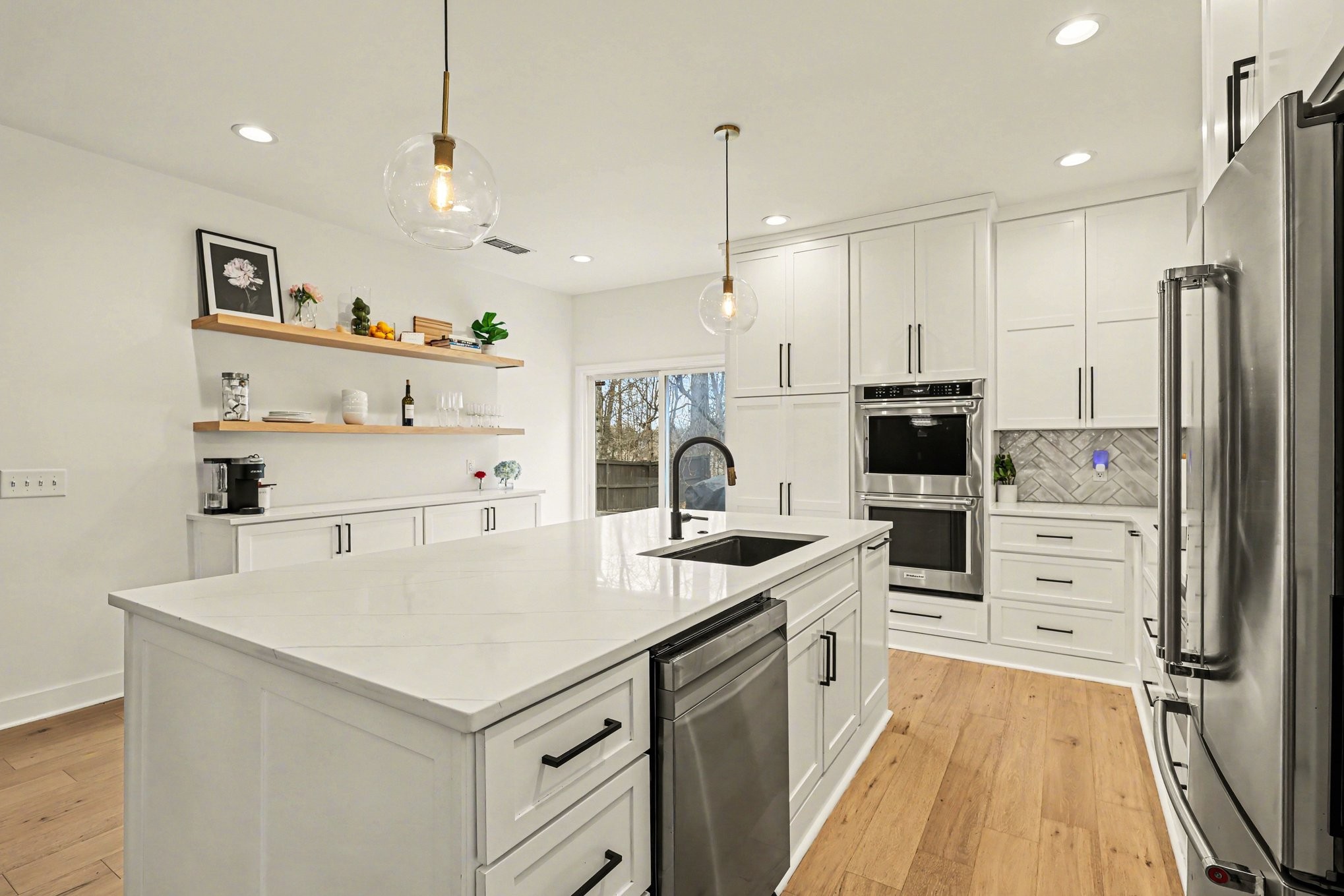 744 Bench Lane Mount Juliet, TN 37122 - Photo 8 of 27 a kitchen with white cabinets and stainless steel appliances