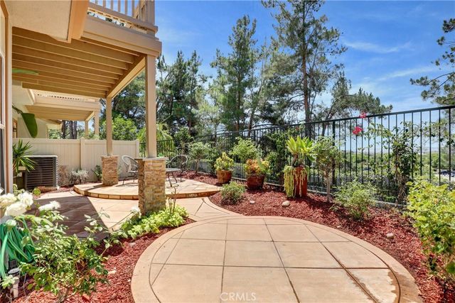 a view of a backyard with sitting area
